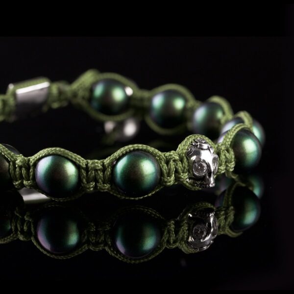 Photo of mother of pearl beads and skull bracelet.
